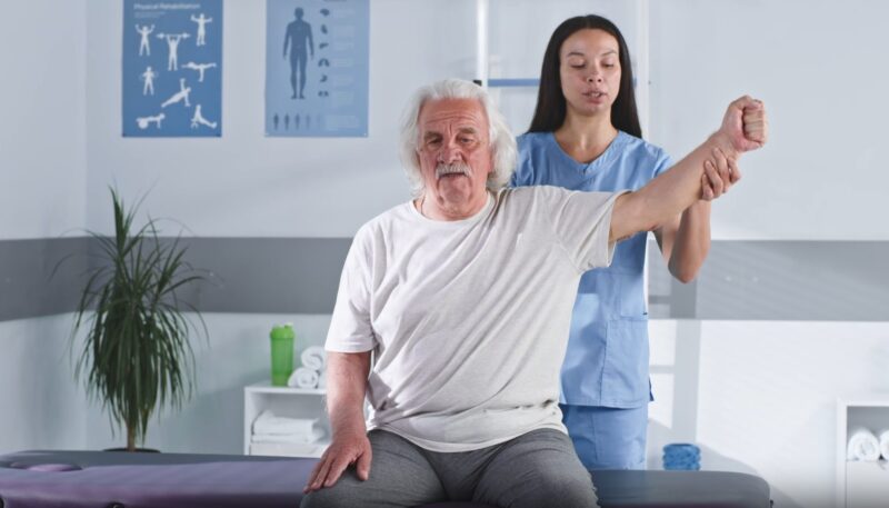Elderly man undergoing physiotherapy